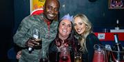 Komedia Christmas Party - partygoers enjoying a night out, wearing Christmas hats.