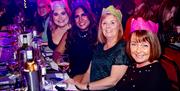Komedia Christmas Party - partygoers enjoying a night out, wearing Christmas hats.