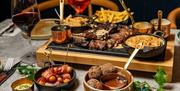 Dishes of delicious steak and sides at Kindling in Brighton