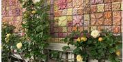 Llanbradach wall relief with roses