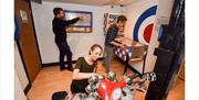 Group of people in room with motorcycle