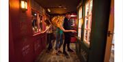 Group of people looking for clues in shop windows