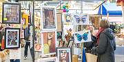 Brighton Open Market - lady showing customer her pictures