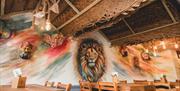 Image of a wall with a painted lion on it.