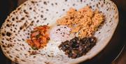 A dish of side accompaniments