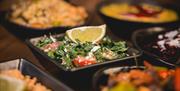 A vibrant dish with fresh herbs and lemon
