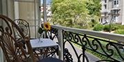 Balcony overlooking leafy square