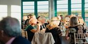 A group enjoys the views from their table.