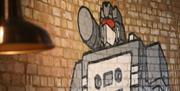 Close up of a brick wall featuring a mural