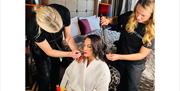Lady being made up before an event.
