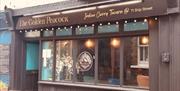 The exterior of The Golden Peacock
