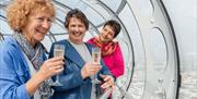 Visitors enjoying a glass of fizz on the Brighton i360