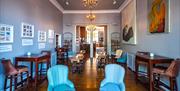 Beautiful dining area with artwork on the walls