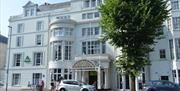 The gorgeous exterior of the hostel on a tree-lined corner of the Old Steine.