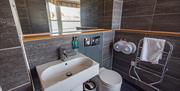 A well-equipped, modern bathroom in the hostel showing the facilities.