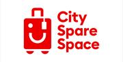 The words city spare space next to a winking trolley, red words on a white background.