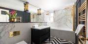 Marble and copper feature bathroom