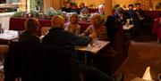 A group of diners enjoying a meal at The Chilli Pickle