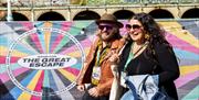 Image courtesy of Nathalie von Rotz. Festival goers at the Great Escape, heading to their next gig, in front of The Great Escape banner.