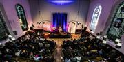 Image courtesy of Nathalie von Rotz. The Unitarian Church with a band performing, one of the great venues showcased as part of the Great Escape Festiv