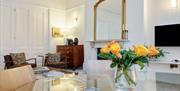 A vase of flowers welcoming guests