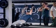 Gym users enjoying using the weights at Pro Academy