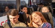 Happy travellers on a National Express coach.