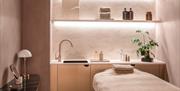 A treatment bed ready to welcome you.
