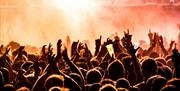 Photo of a crowd enjoying an event. The image was taken by Tijs Van Leur and was downloaded from the Unsplash website.
