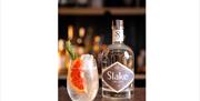 Slake Spririts - bottle and drink on bar