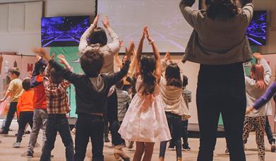 Kids participating in a theatre workshop