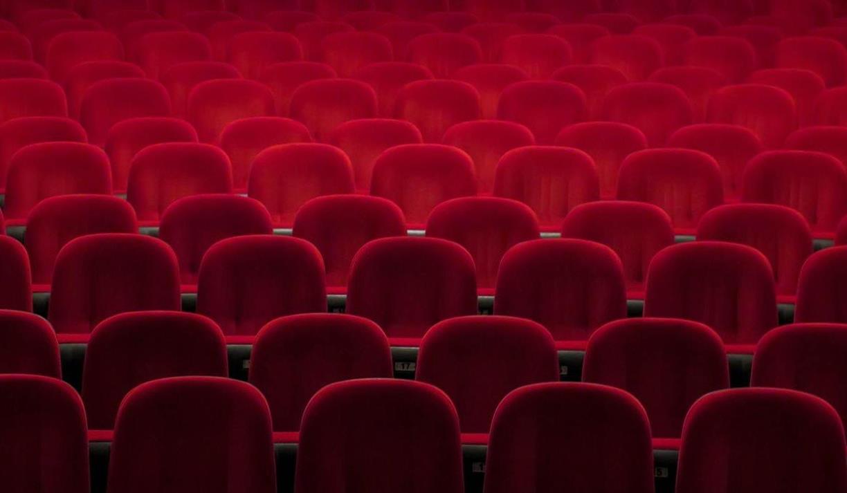 Empty red seats in a theatre