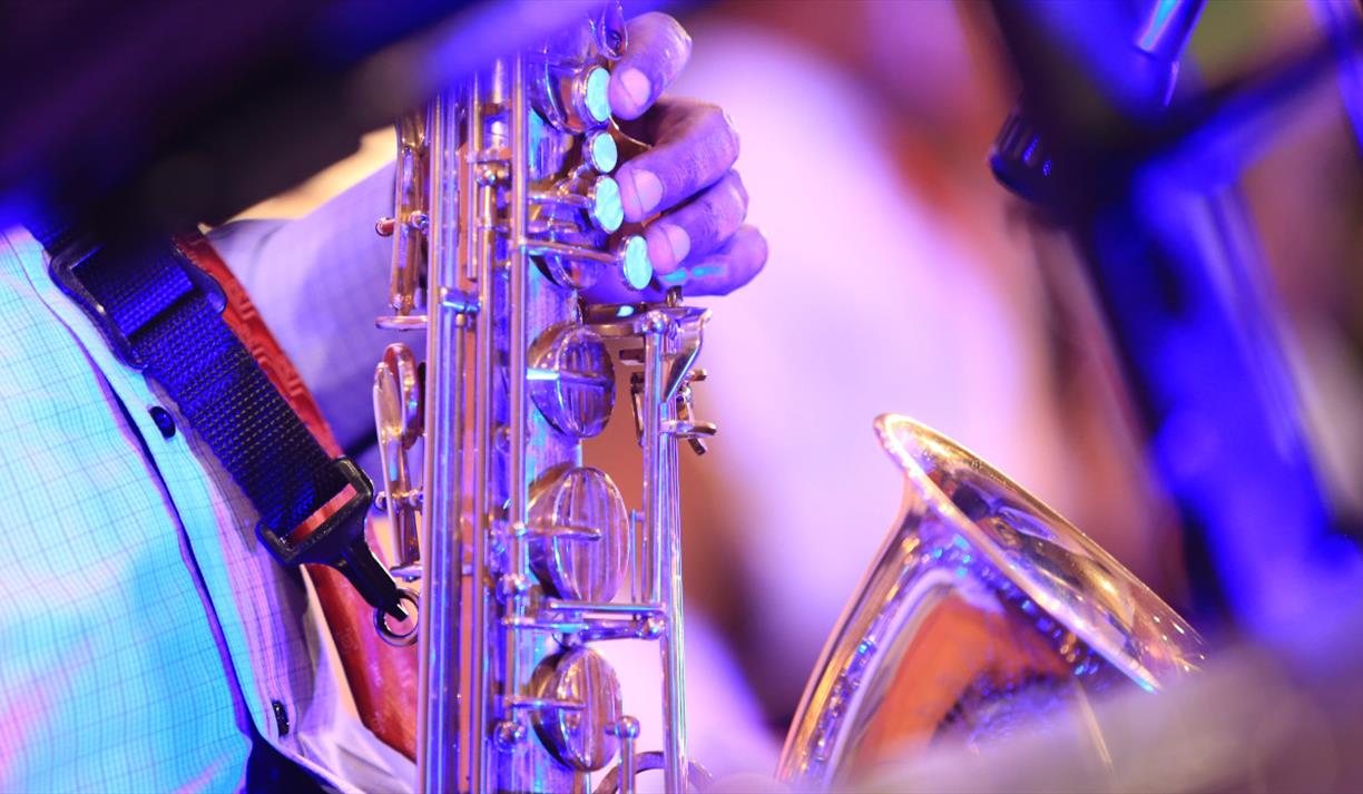 A close up of a golden saxophone A close up of a golden saxophone