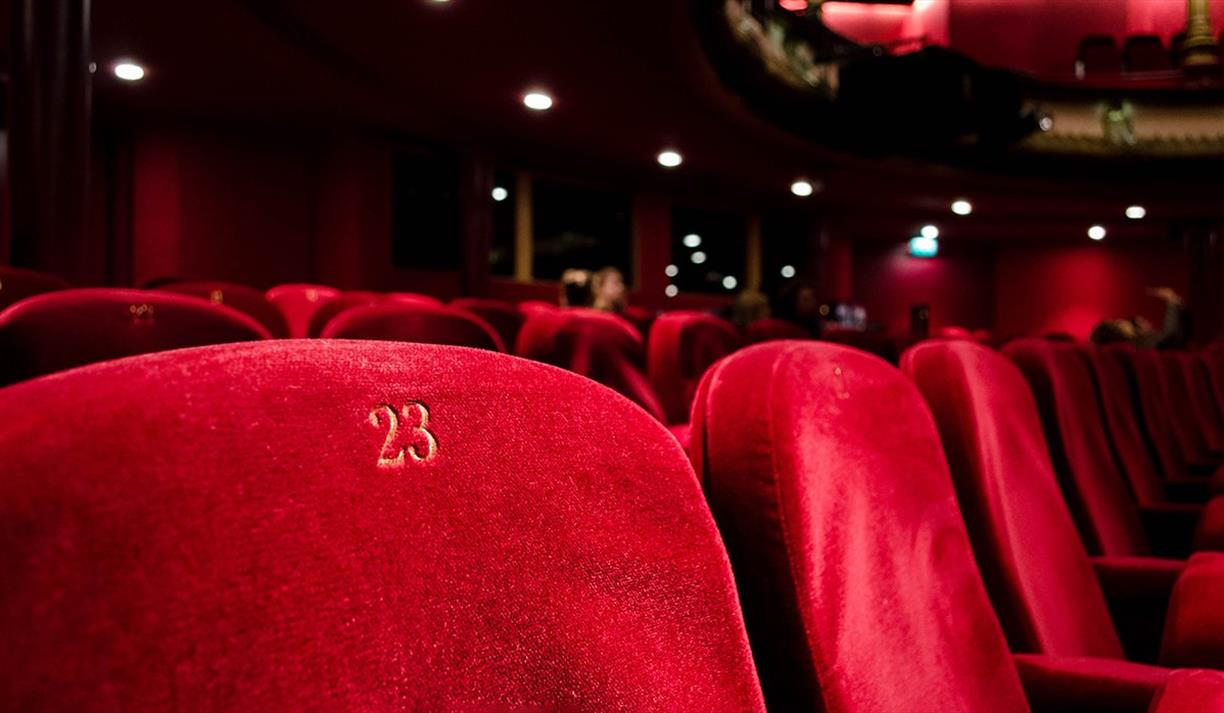 Red numbered seats at a theatre