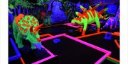 Fluorescent Triceratops and Stegosaurus dinosaurs