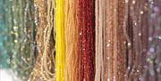 Different coloured strings of beads