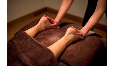feet being massaged
