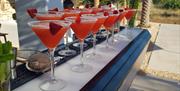 Southside Bars - cocktails lined up along a bar