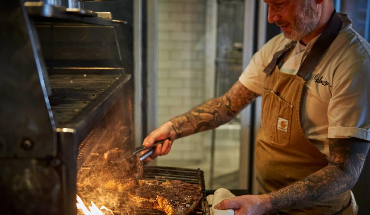 Malmaison Bar & Grill - chef grilling steak