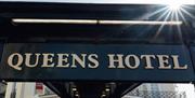 Queens Hotel exterior sign