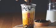 Gong cha Tea - tapioca pearls being spooned in
