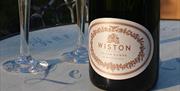 Wiston Estate - bottle of wine and glasses 
