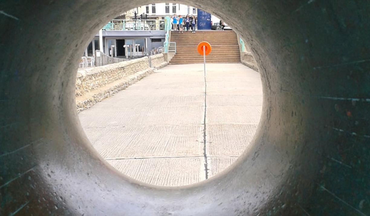 View through pipe on seafront