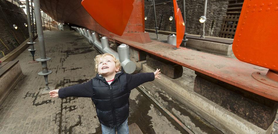 Child looking at Brunel's SS Great Britain propeller