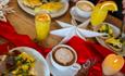 Breakfast spread (coffee, poached eggs, orange juice)