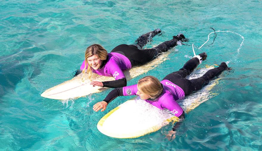 women on surfboards