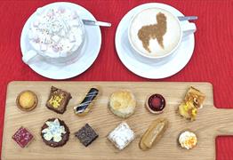 Display of cakes, coffee and hot chocolate