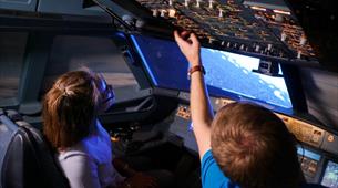 children in aircraft simulator 