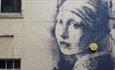 Banksy's Girl With The Pierced Eardrum in Bristol