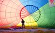 Person inside a hot air balloon at Bristol Balloon Fiesta Launch